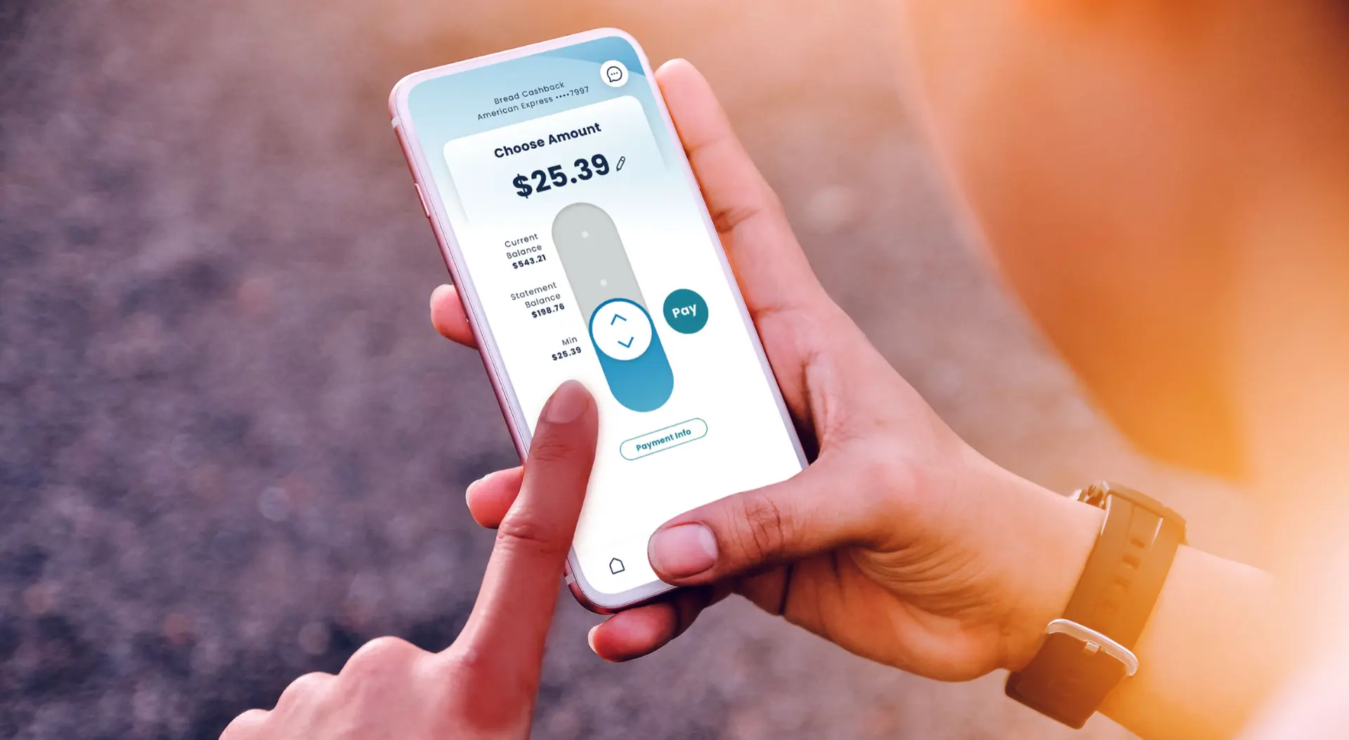 Hands holding a phone showing the Bread Cashback American Express app with a Choose Amount payment screen, a slider control, and a teal Pay button